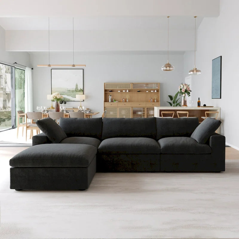 Canapé d'angle surdimensionné en duvet noir avec pouf