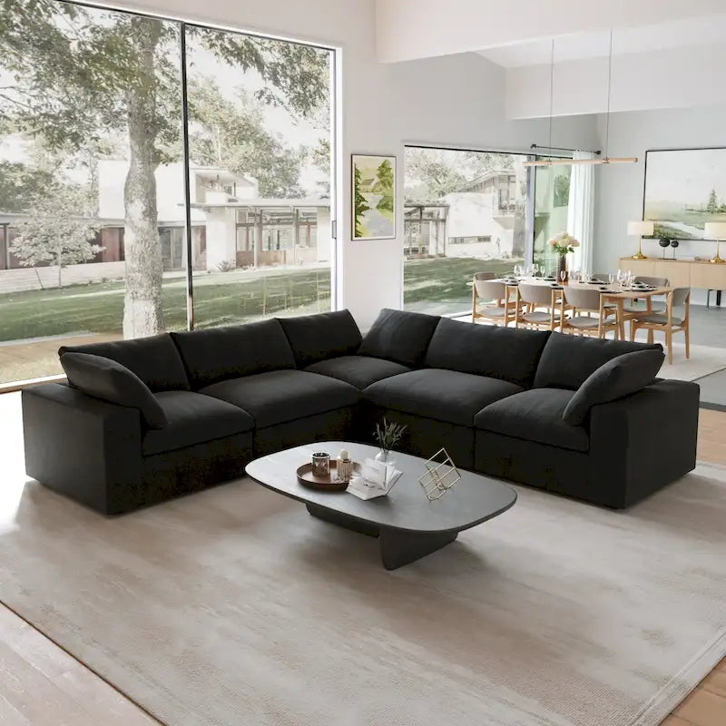 Canapé d'angle surdimensionné en duvet noir avec pouf