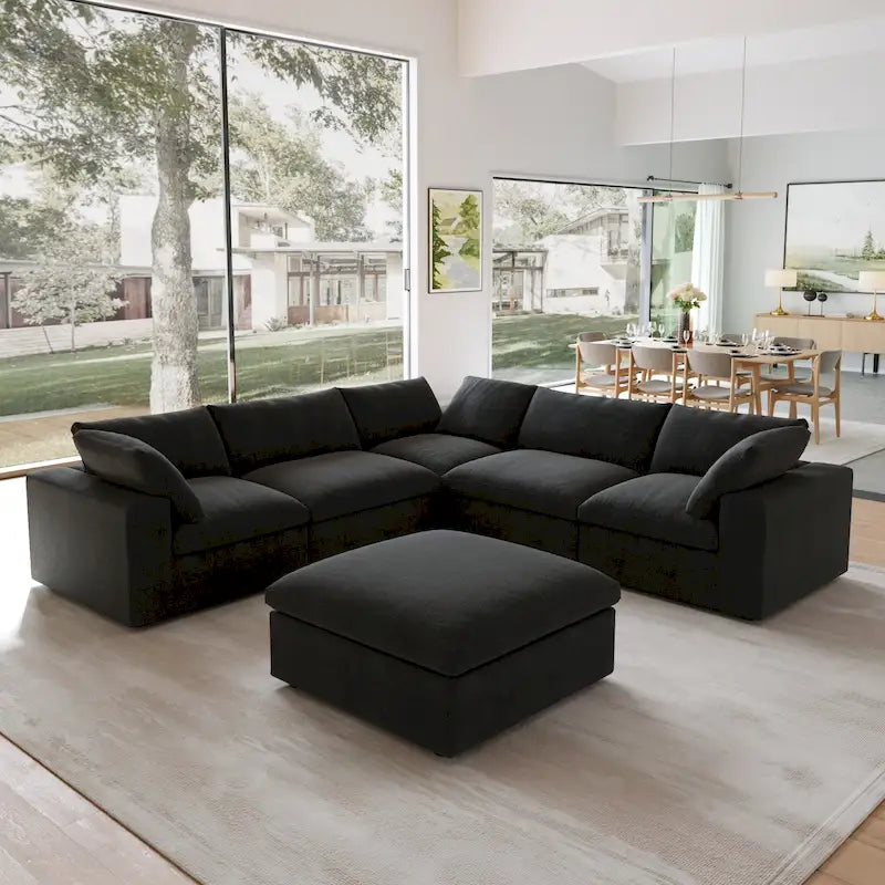 Canapé d'angle surdimensionné en duvet noir avec pouf