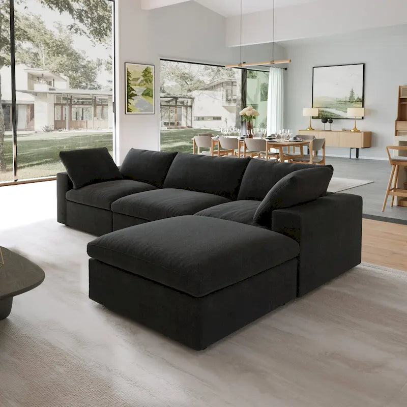 Canapé d'angle surdimensionné en duvet noir avec pouf