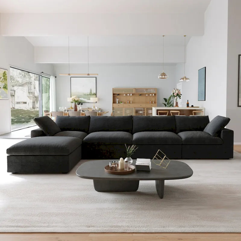 Canapé d'angle surdimensionné en duvet noir avec pouf