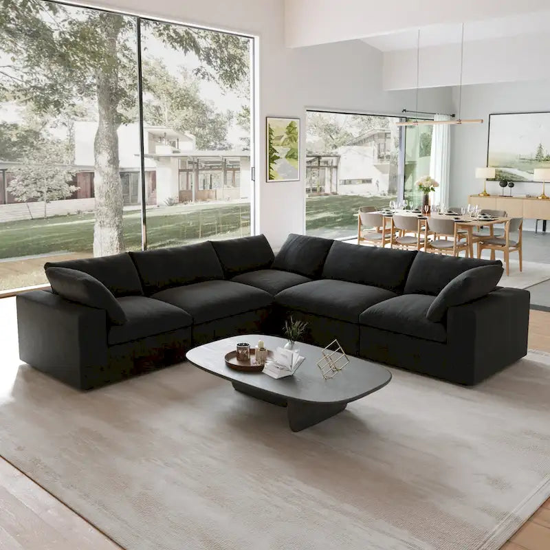 Canapé d'angle surdimensionné en duvet noir avec pouf