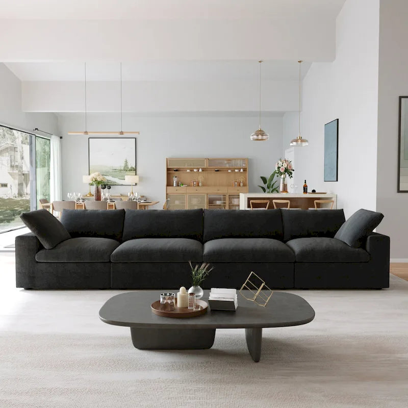 Canapé d'angle surdimensionné en duvet noir avec pouf