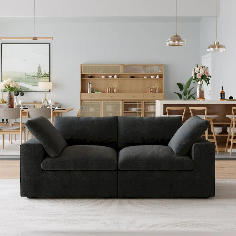 Canapé d'angle surdimensionné en duvet noir avec pouf