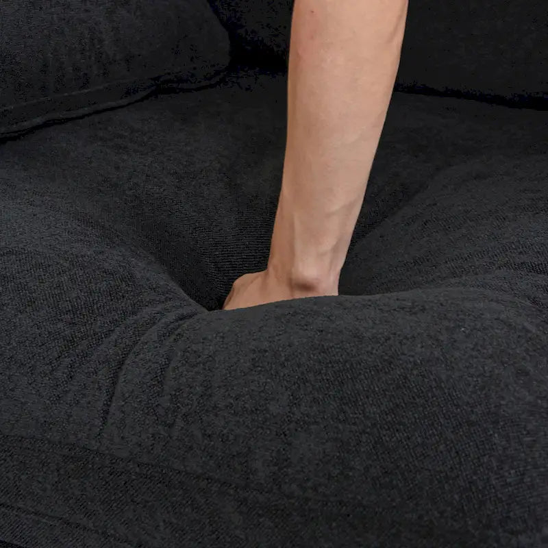 Canapé d'angle surdimensionné en duvet noir avec pouf