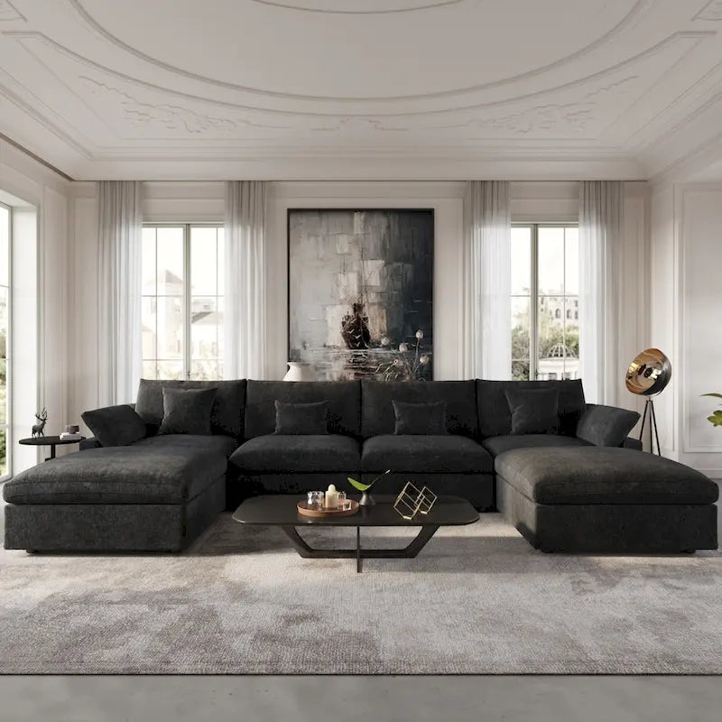 Canapé d'angle surdimensionné en duvet noir avec pouf