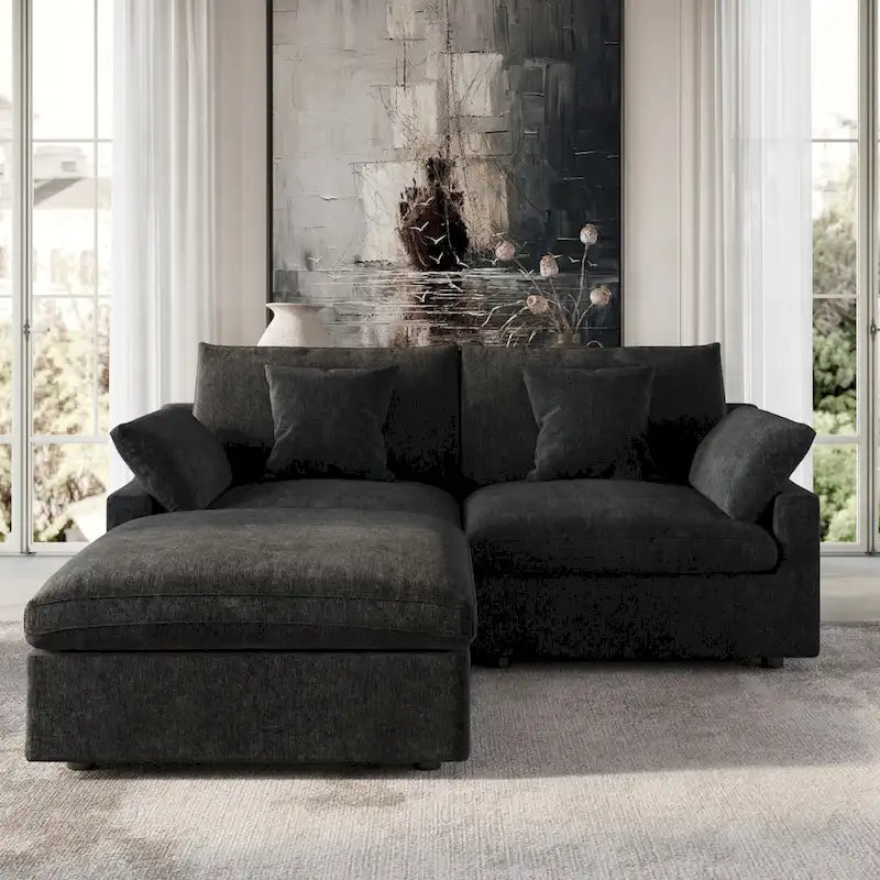 Canapé d'angle surdimensionné en duvet noir avec pouf